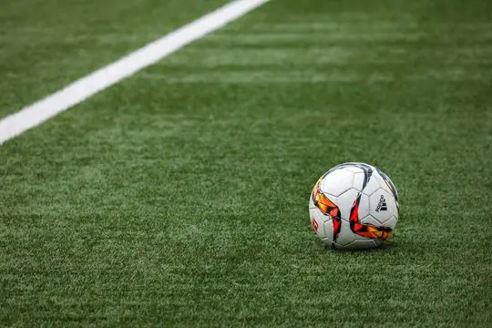 a ball on a lush, green synthetic lawn installed in a sports field in Reno, NV