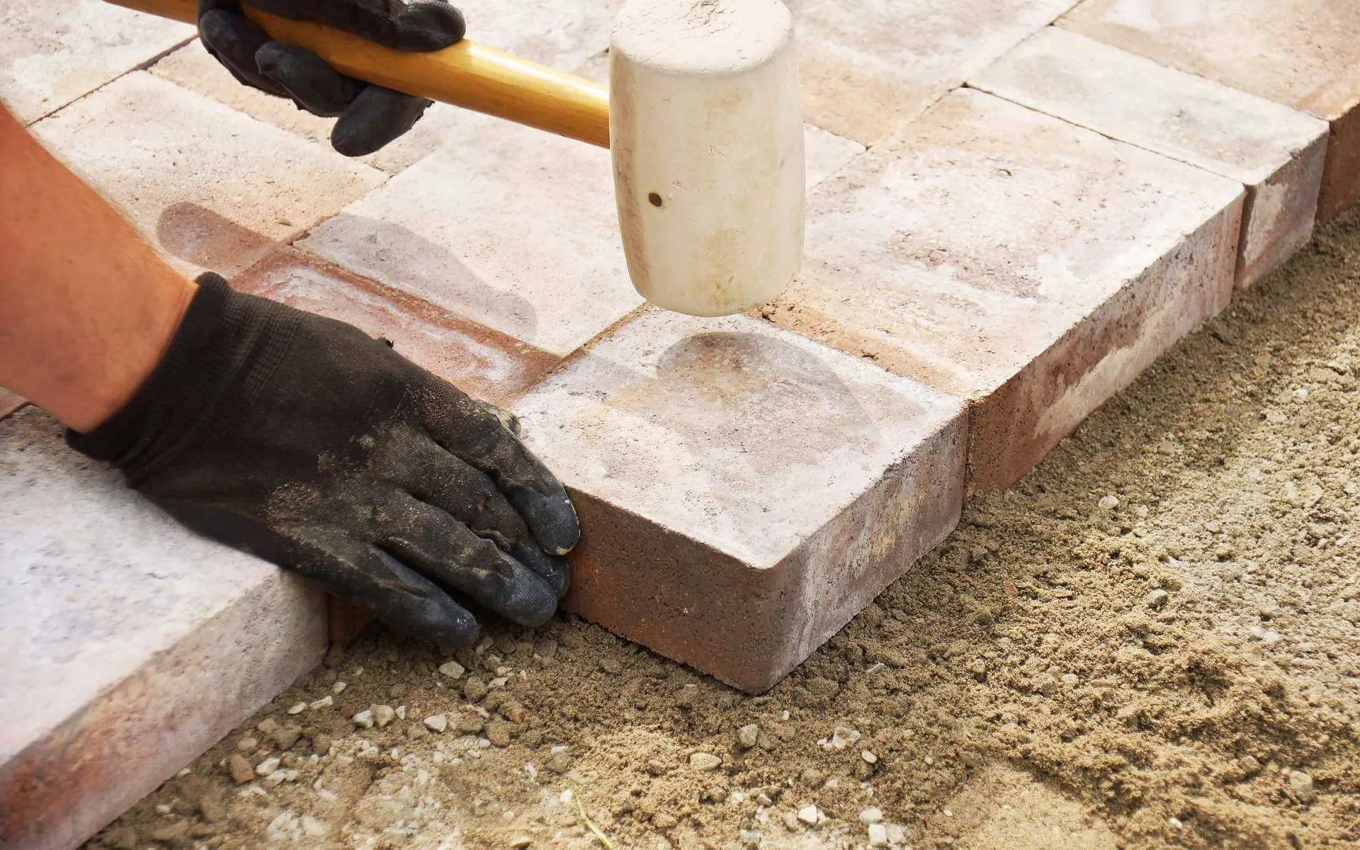 paver contractor laying the pavers